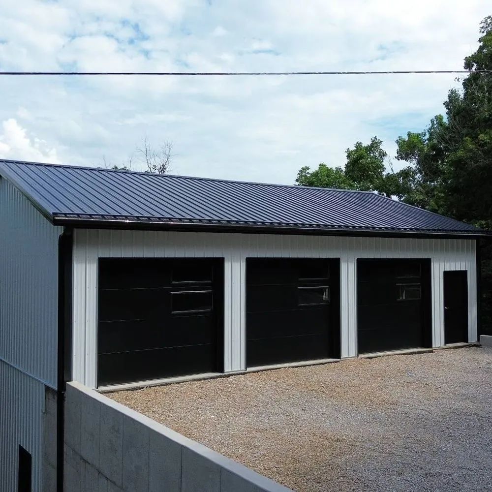 Custom garage with metal siding and overhead door