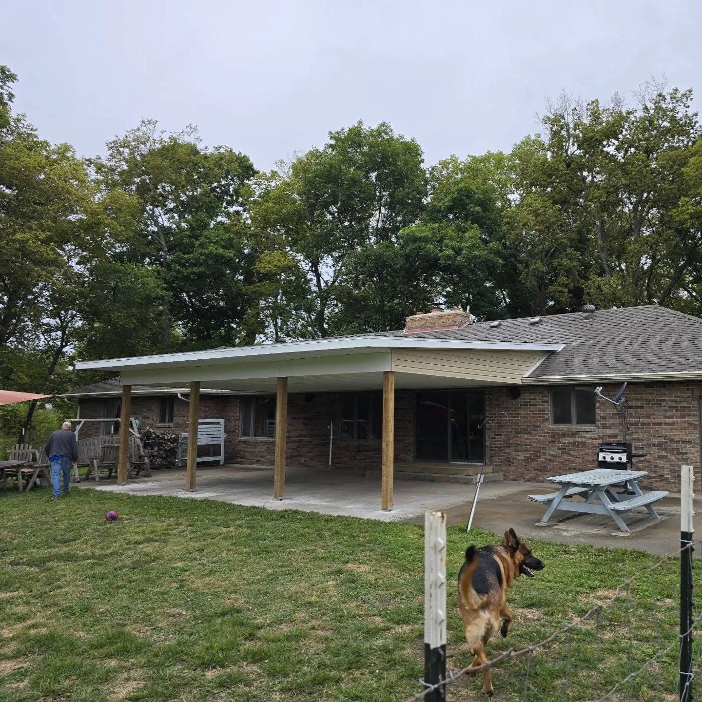Custom patio roof built over a rear patio in Butler, Missouri