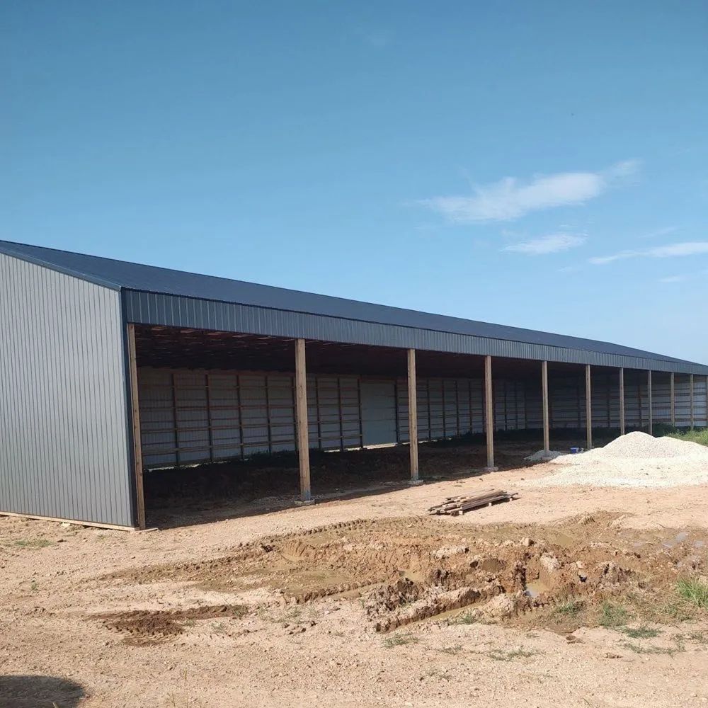Open-sided hay barn framed and roofed on Missouri farm ground