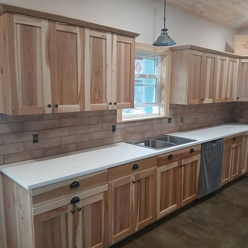 Finished kitchen with cabinetry and island from a turnkey home build