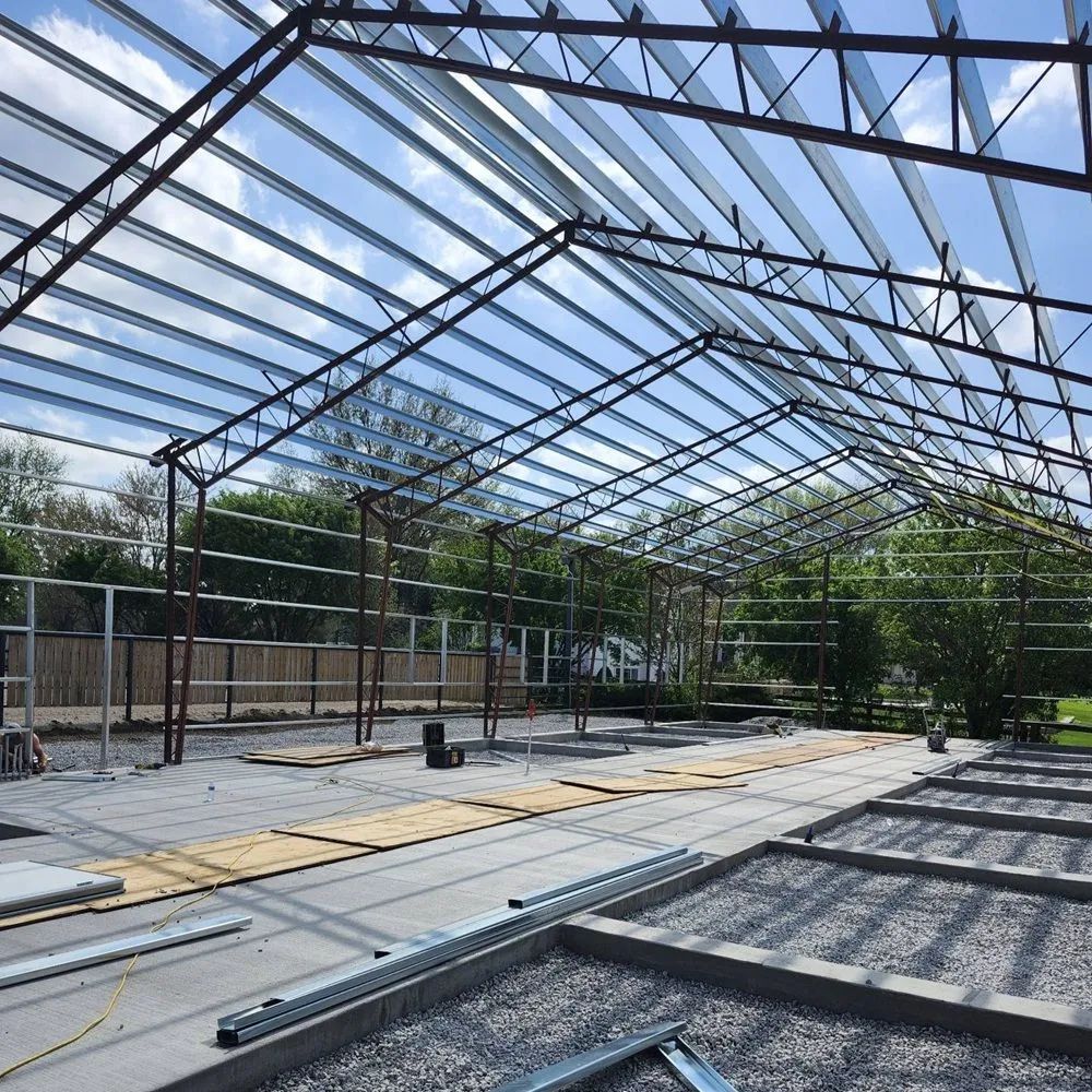 Steel building erected on a prepared site
